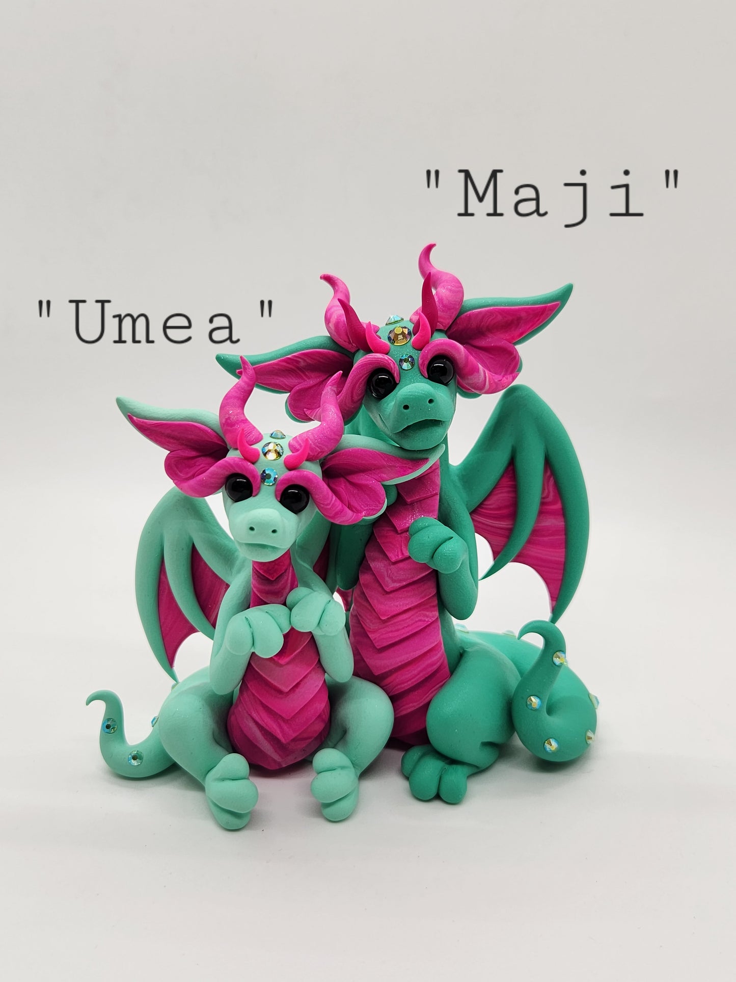 "Maji & Umea" green and pink dragon mother and child sculpture