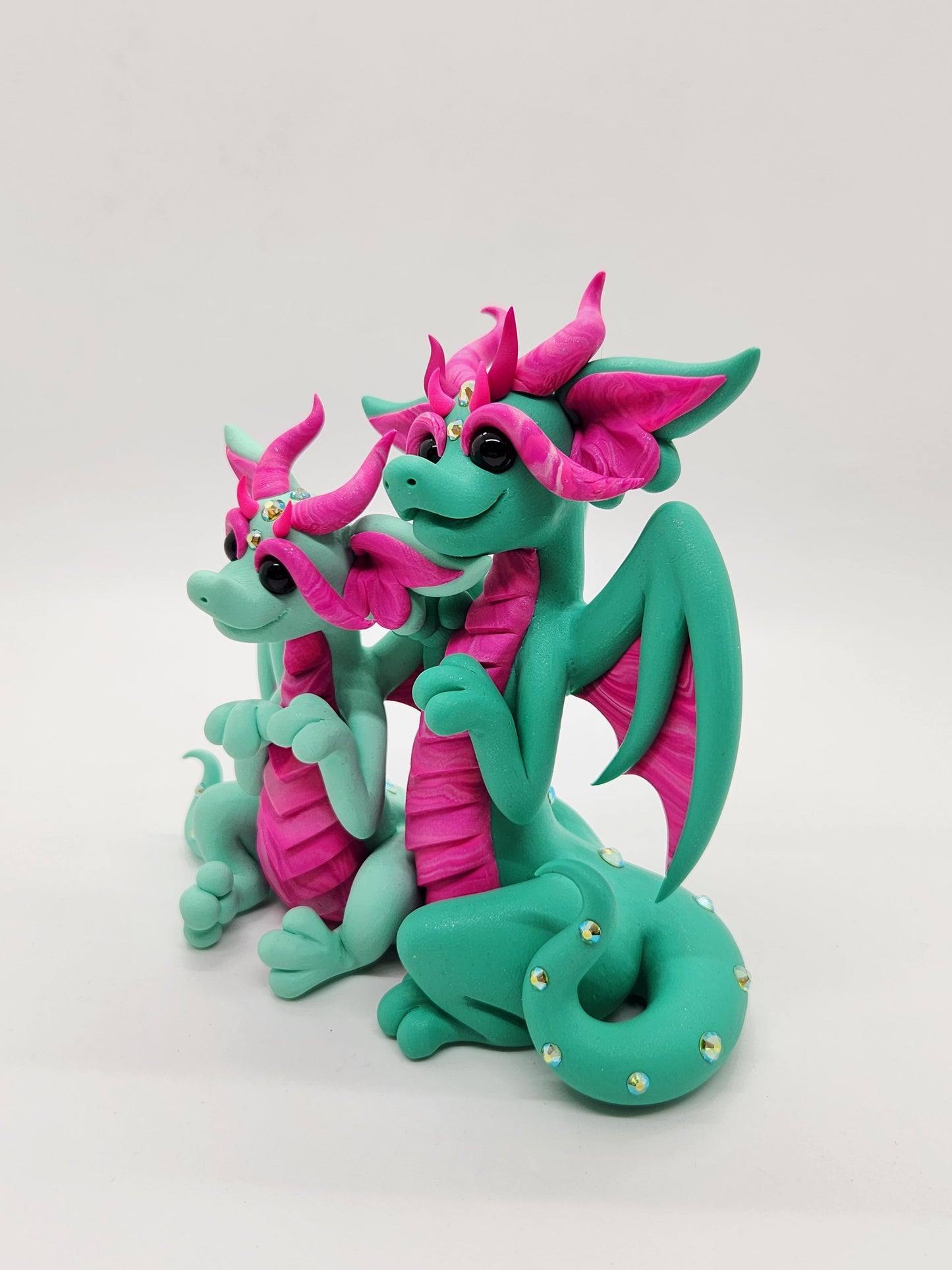 "Maji & Umea" green and pink dragon mother and child sculpture