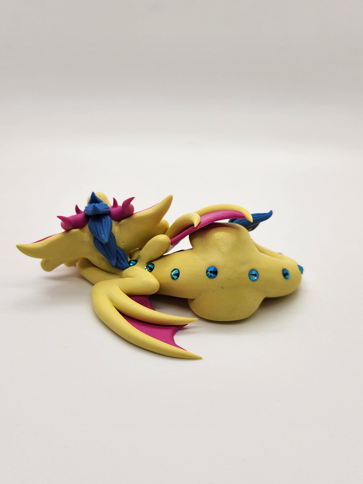 "Devin" yellow and pink pan pride dragon sculpture