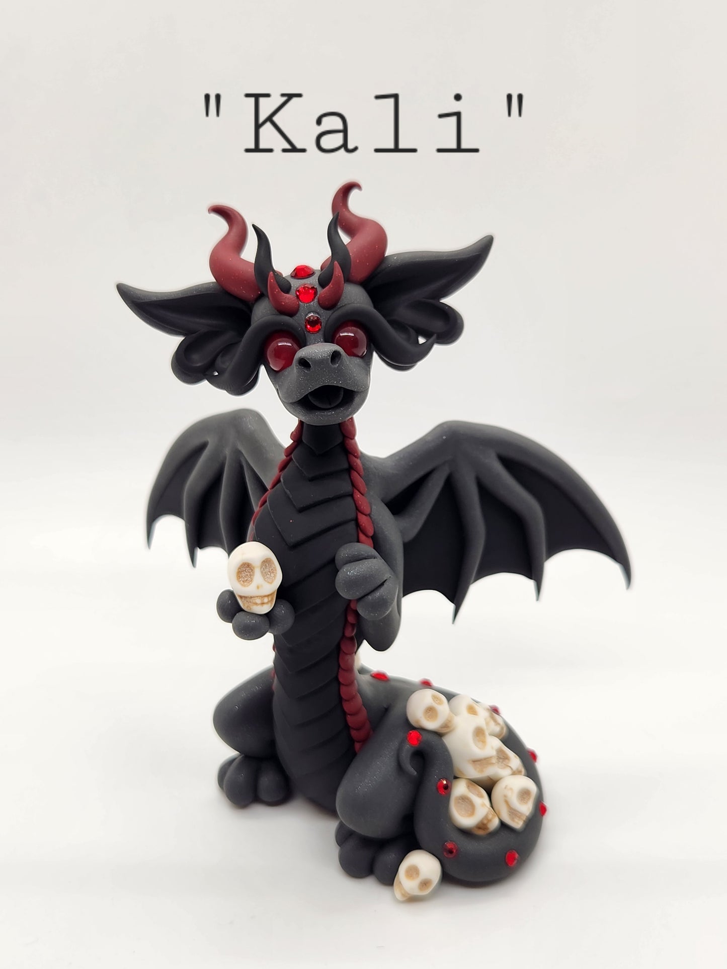 "Kali" black bat dragon and skulls sculpture