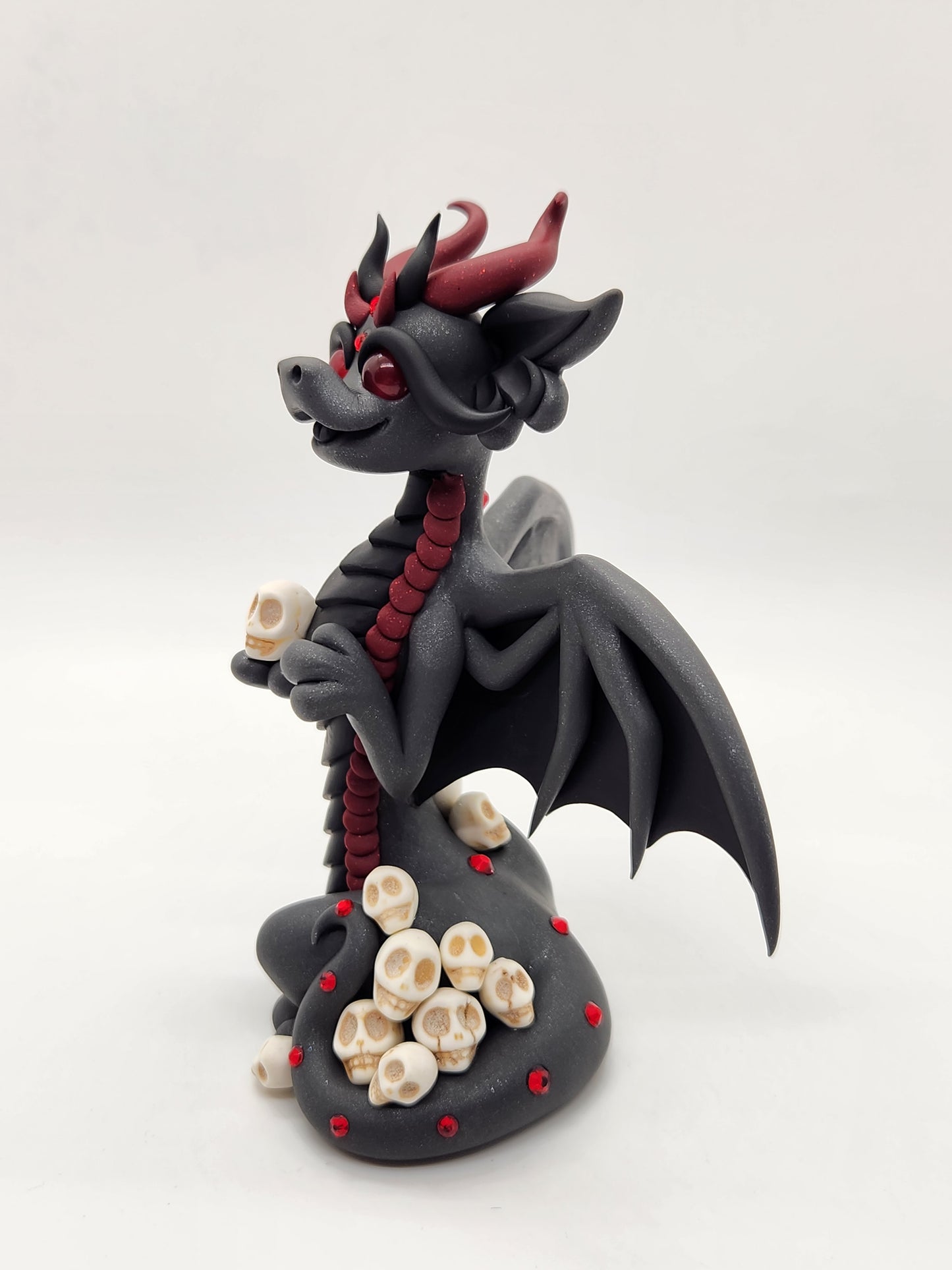 "Kali" black bat dragon and skulls sculpture