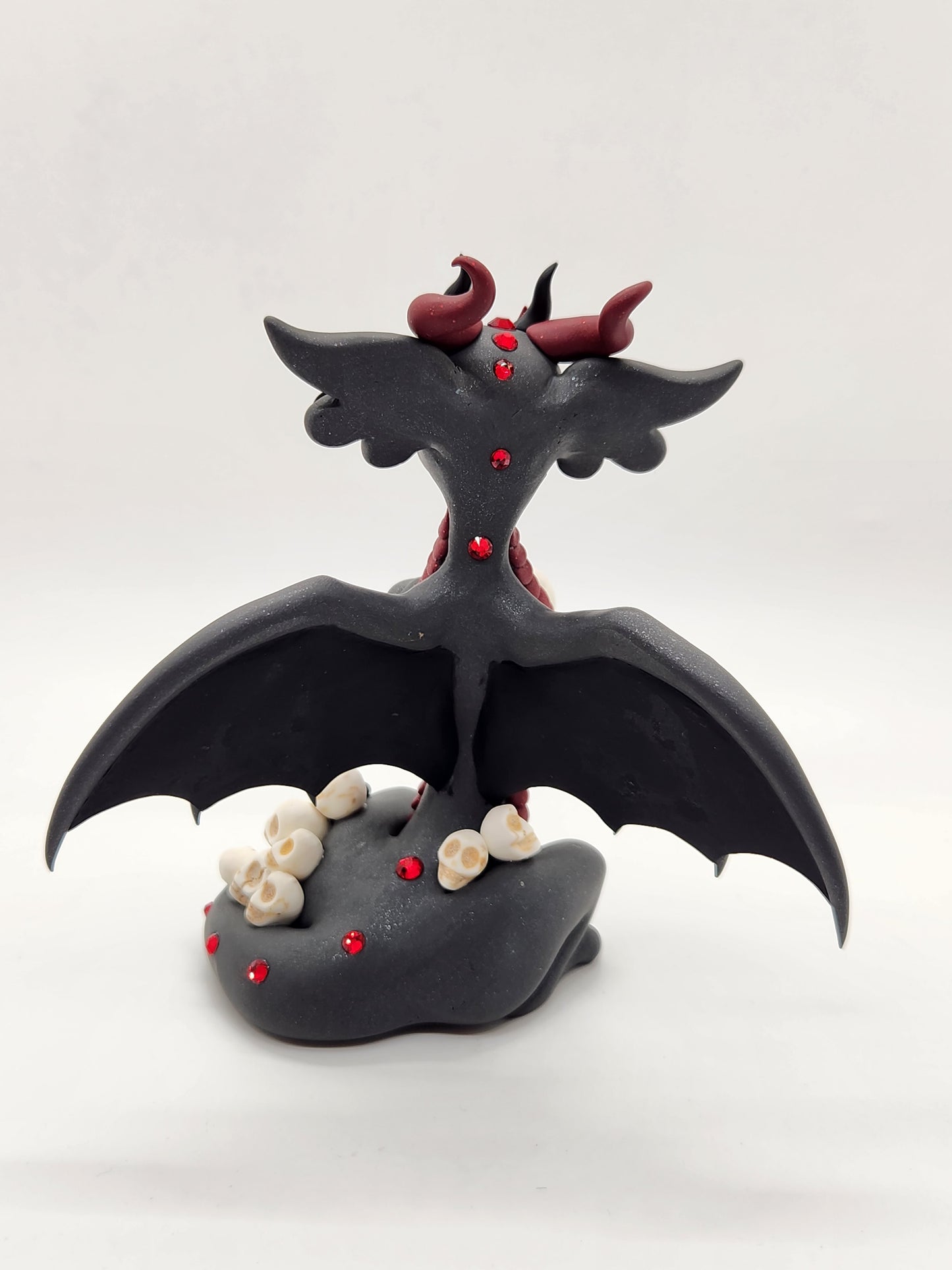 "Kali" black bat dragon and skulls sculpture