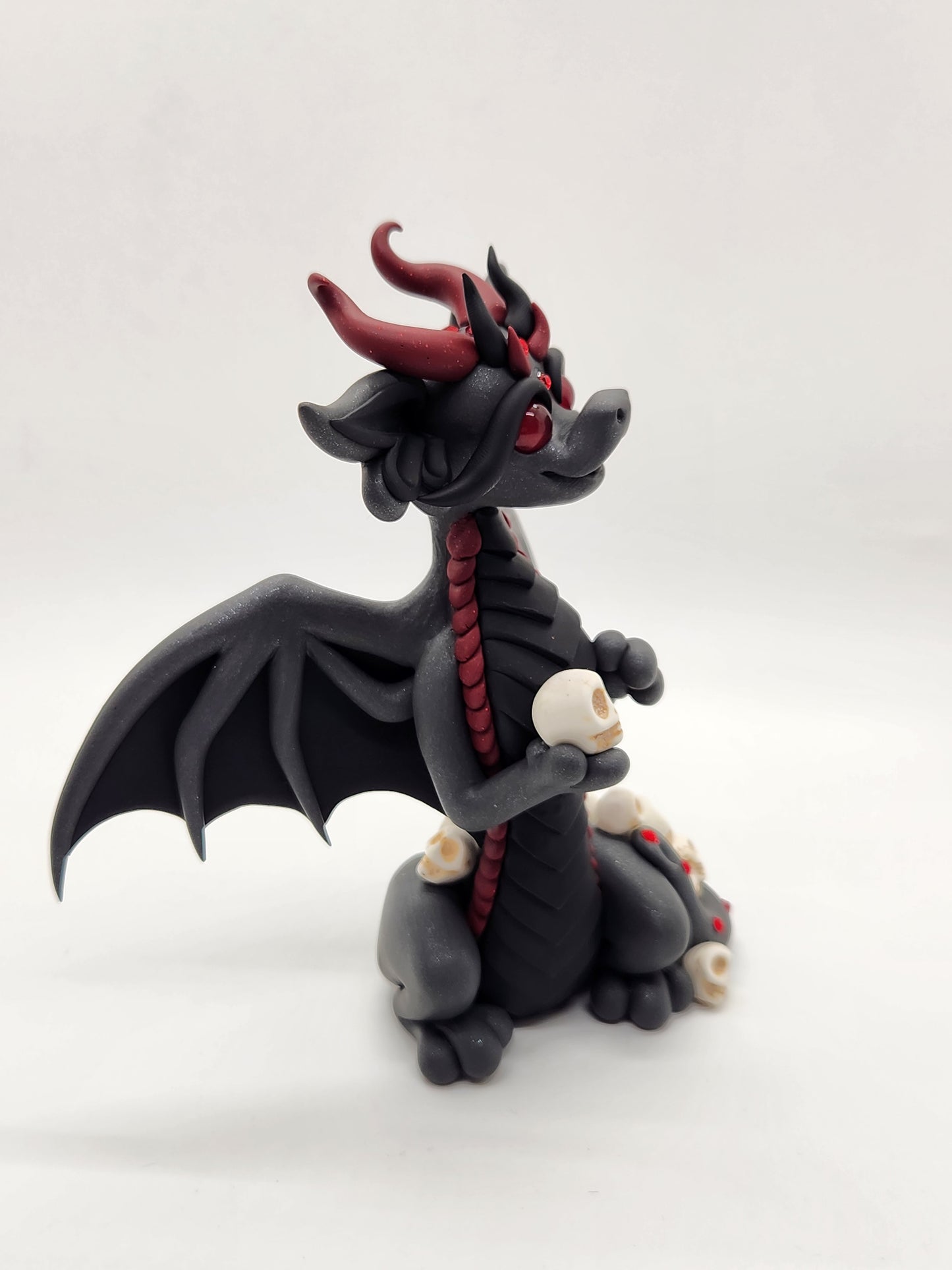 "Kali" black bat dragon and skulls sculpture