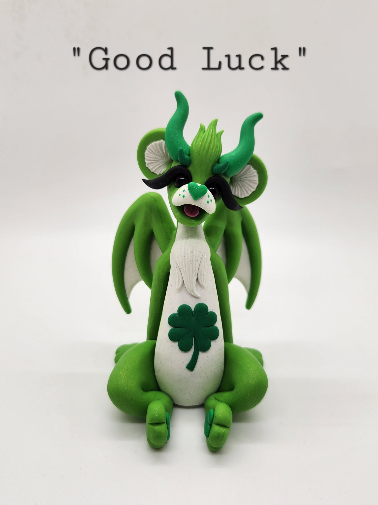 "Good Luck" green care bear dragon sculpture