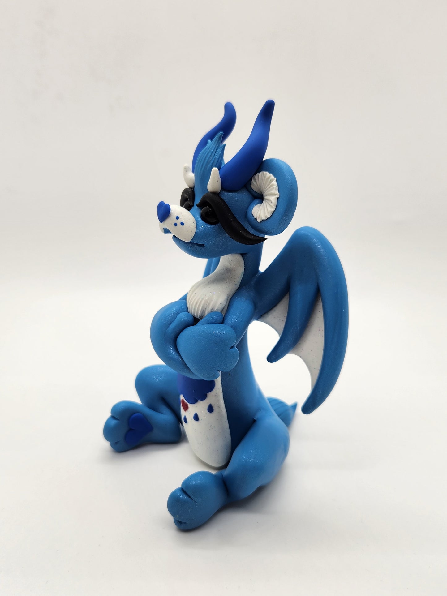 "Grumpy" blue care bear dragon sculpture