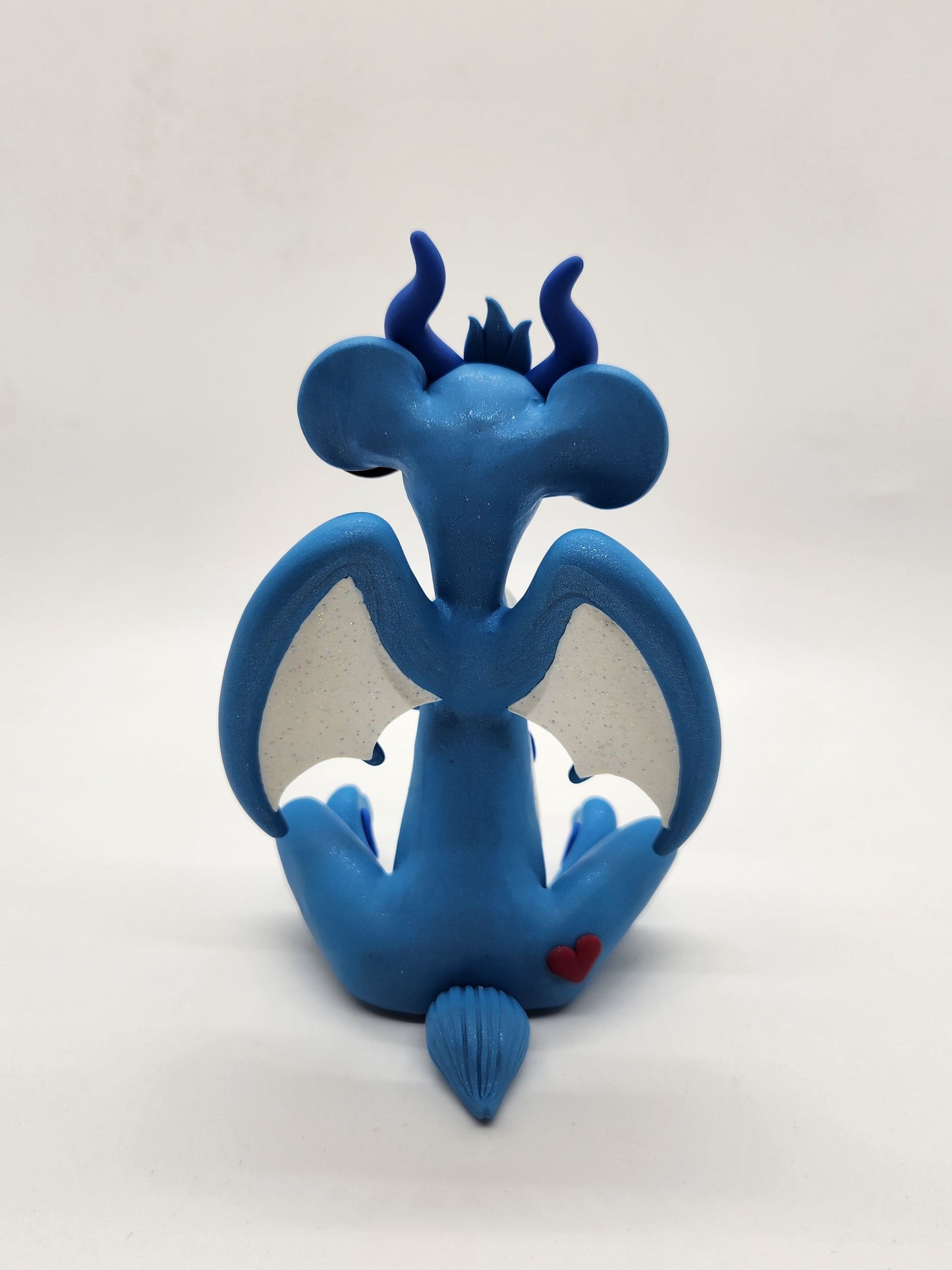 "Grumpy" blue care bear dragon sculpture