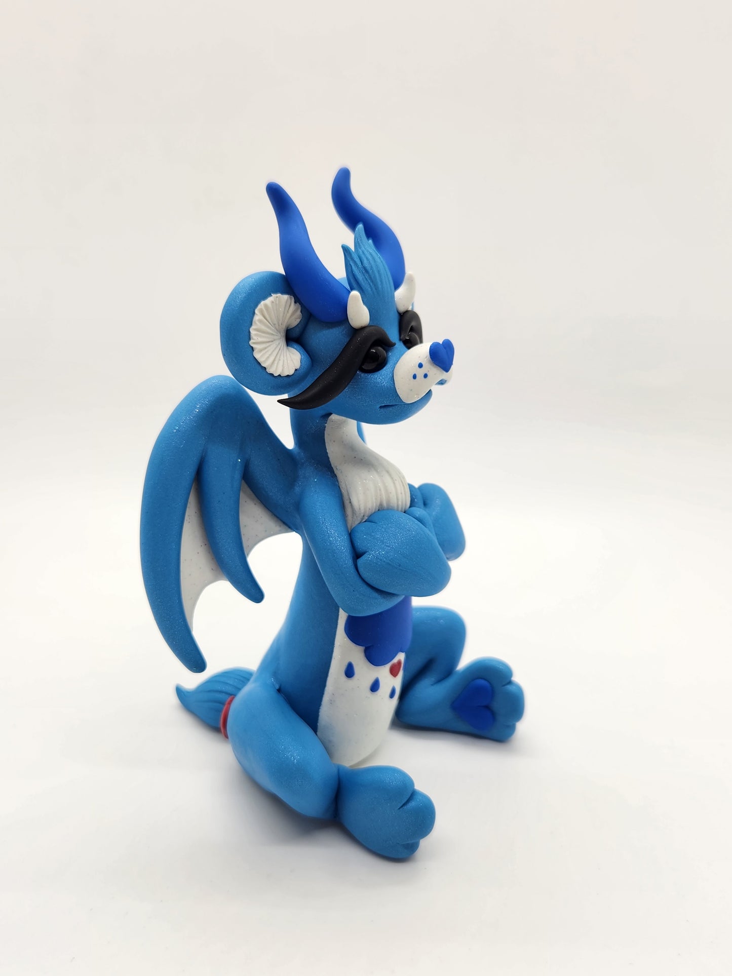 "Grumpy" blue care bear dragon sculpture