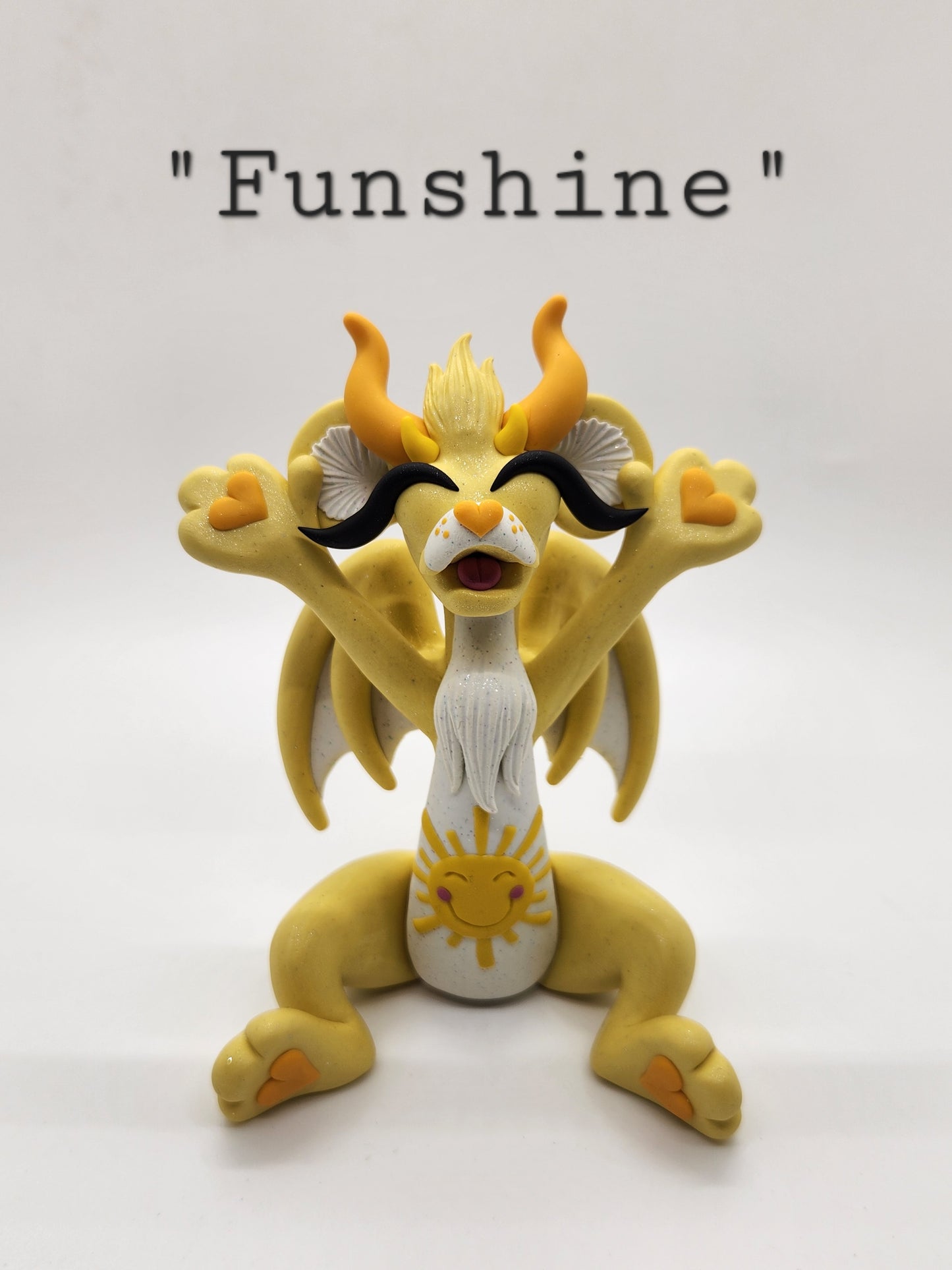 "Funshine" yellow care bear dragon sculpture