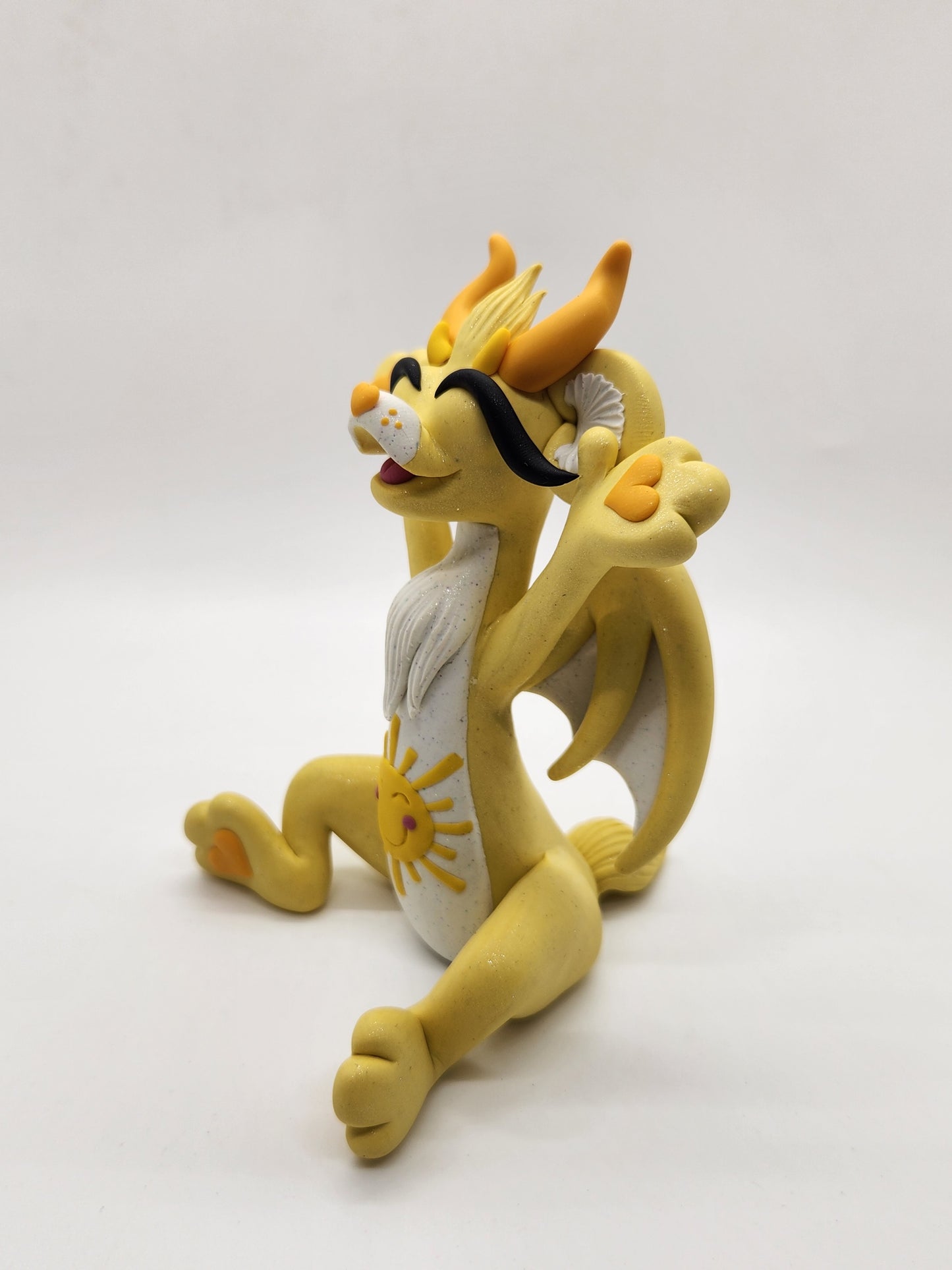 "Funshine" yellow care bear dragon sculpture