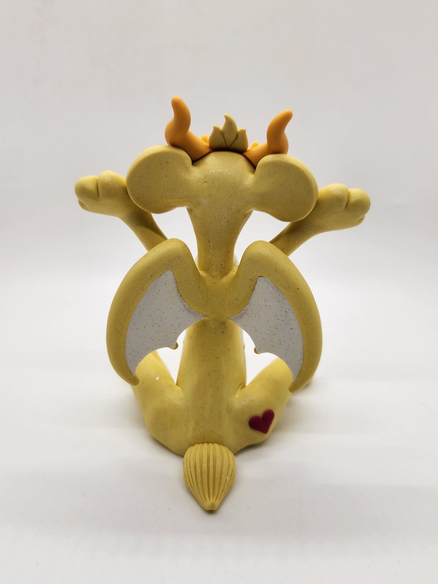 "Funshine" yellow care bear dragon sculpture