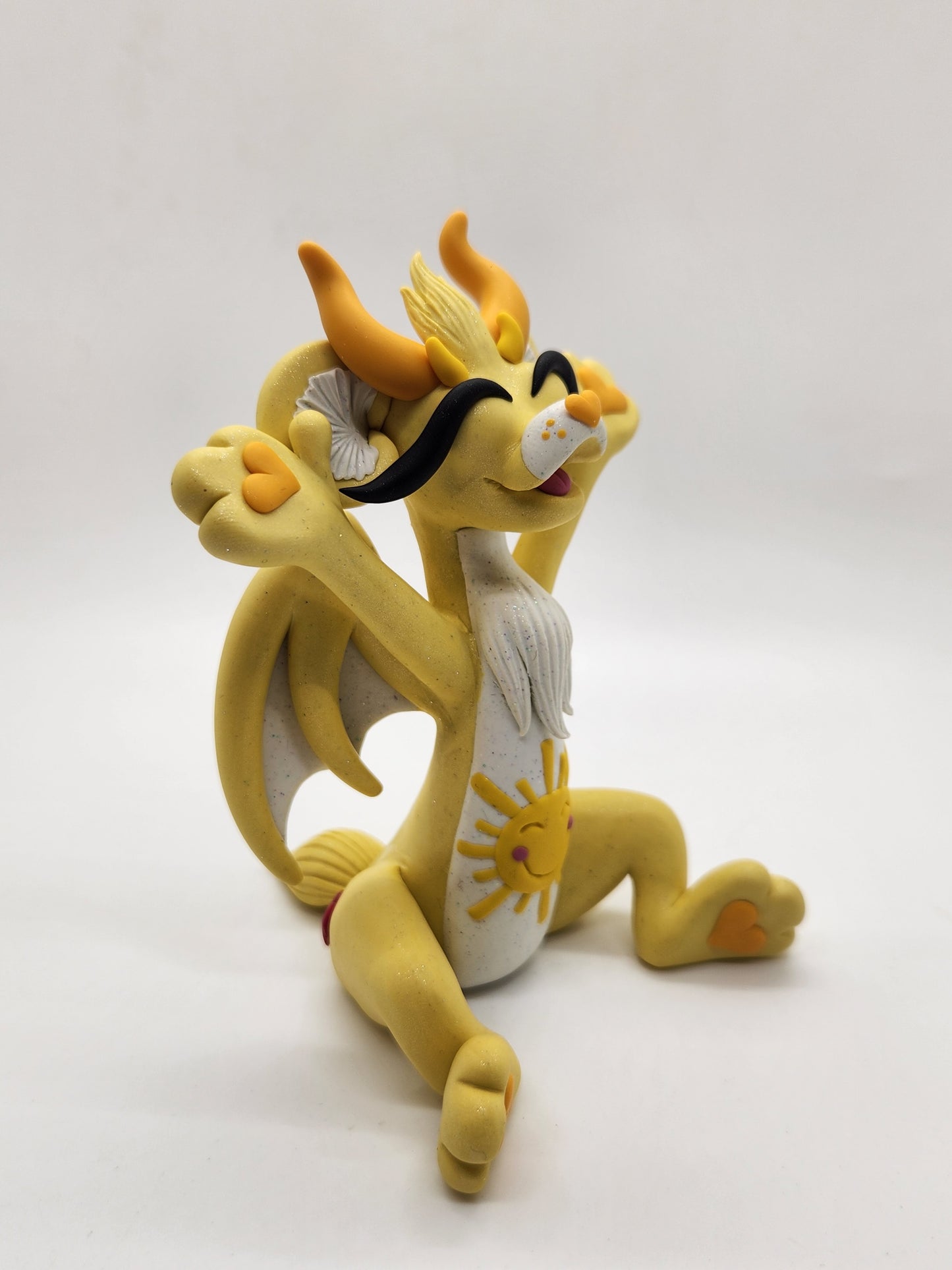 "Funshine" yellow care bear dragon sculpture