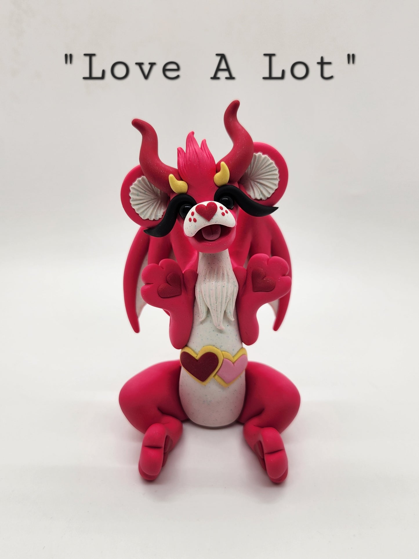 "Love A Lot" pink care bear dragon sculpture