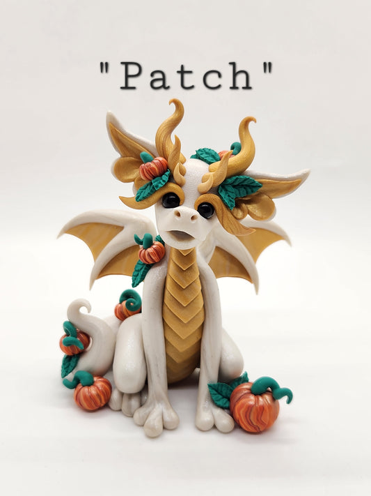 "Patch" white and gold pumpkin dragon sculpture