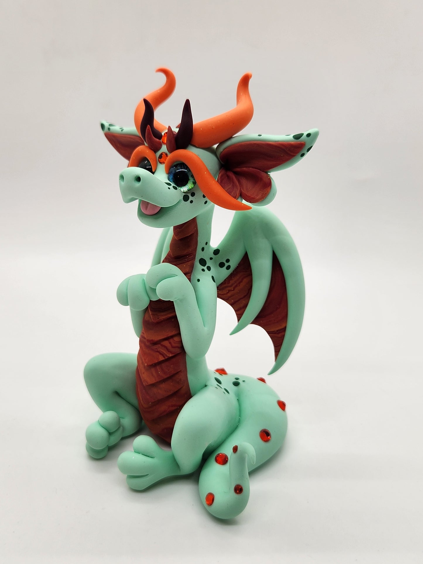 "Áilleacht" green and orange dragon sculpture