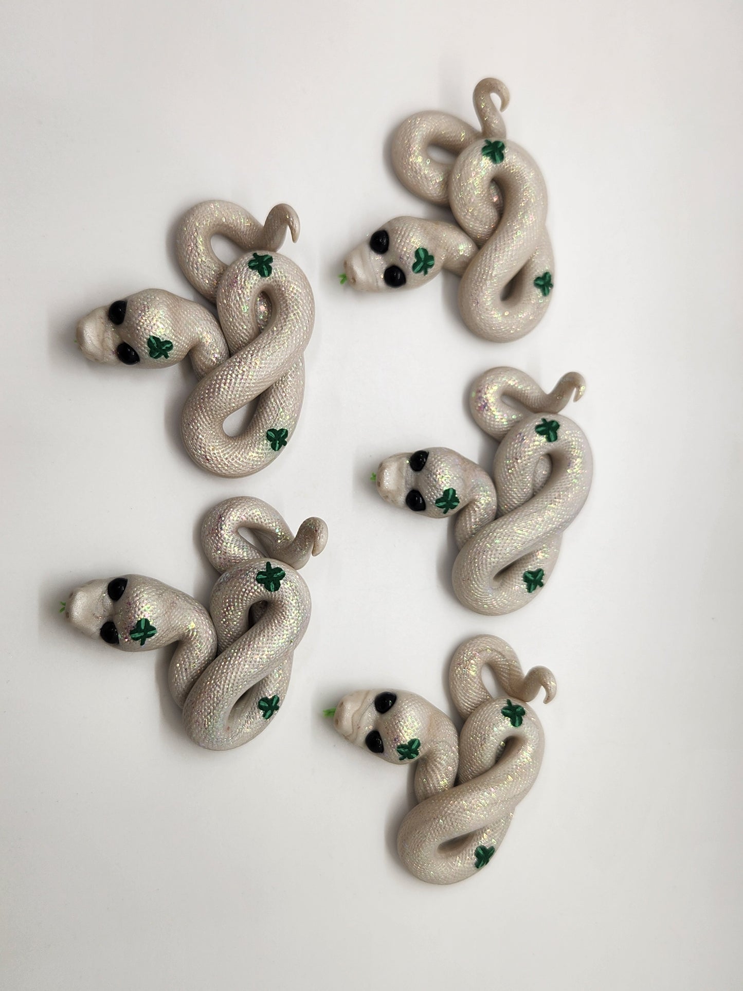 "Nathair" white and green snake sculpture