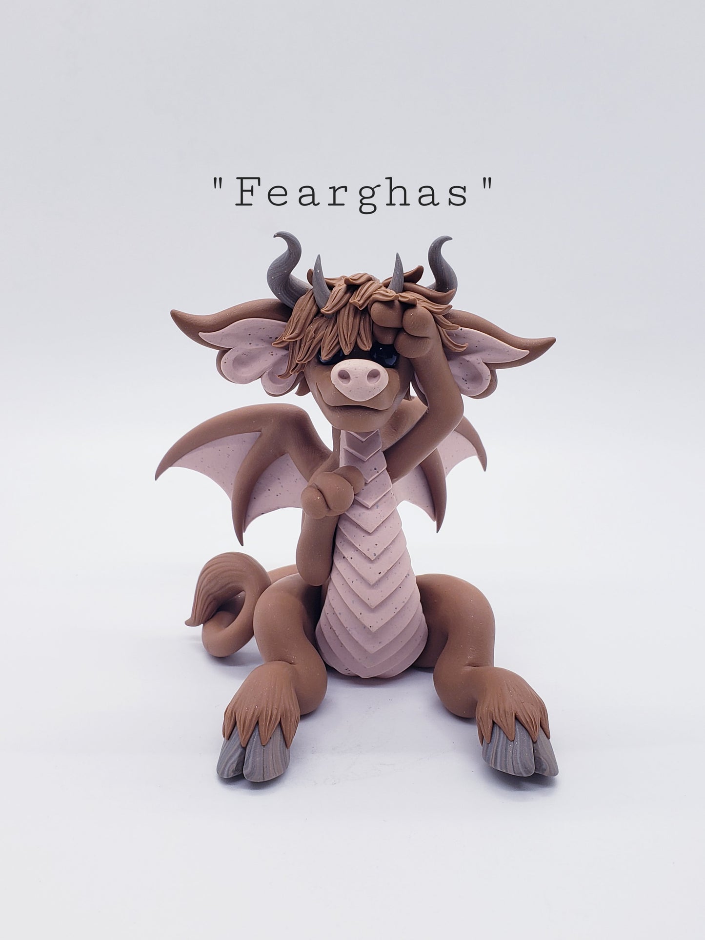 "Fearghas" highland cow dragon sculpture