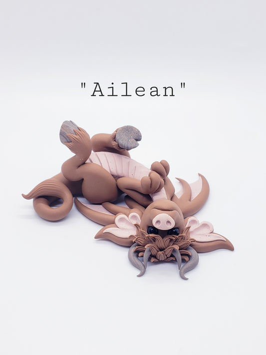 "Ailean" highland cow dragon sculpture