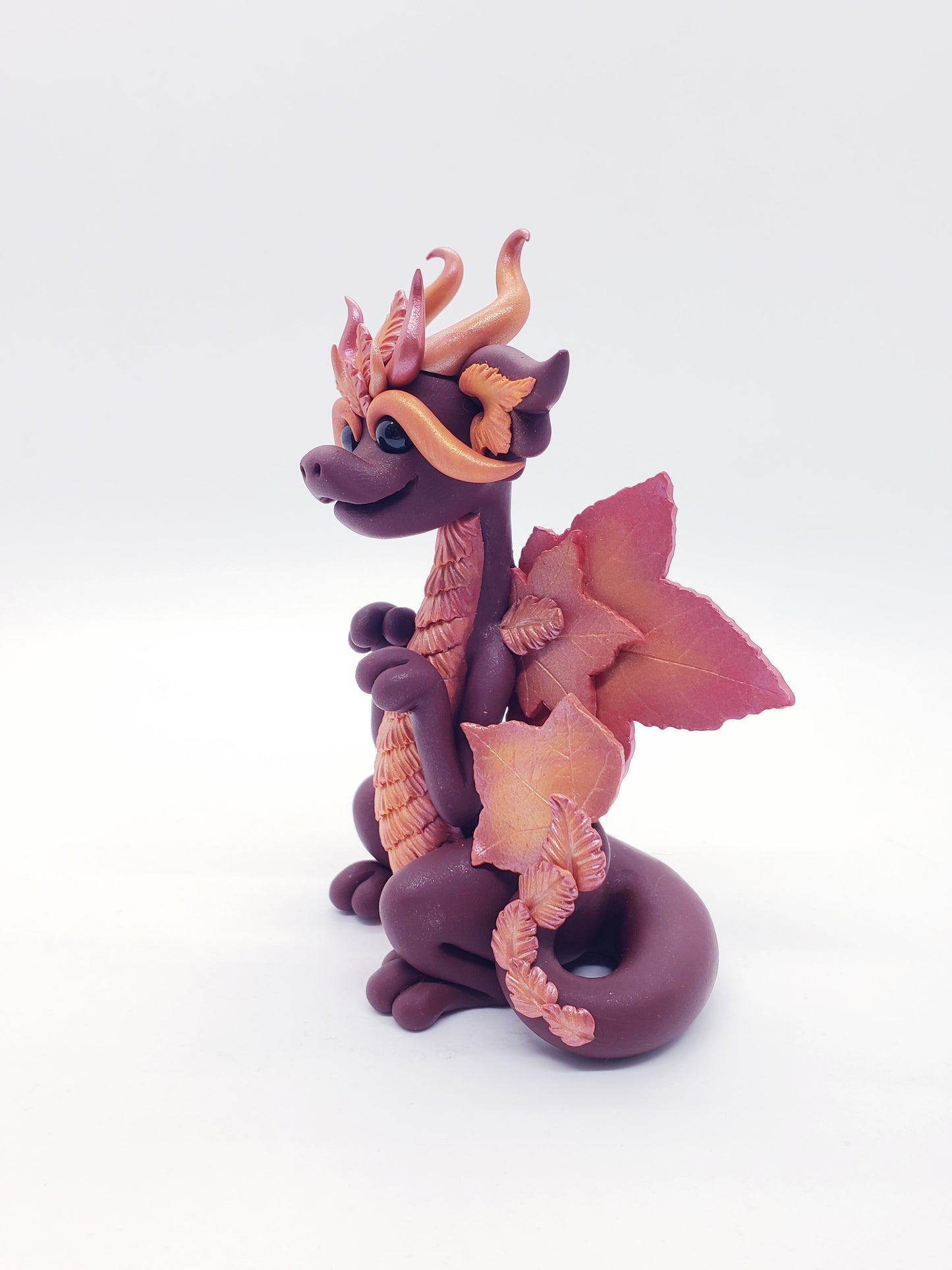 "Foglia" red autumn leaf dragon sculpture