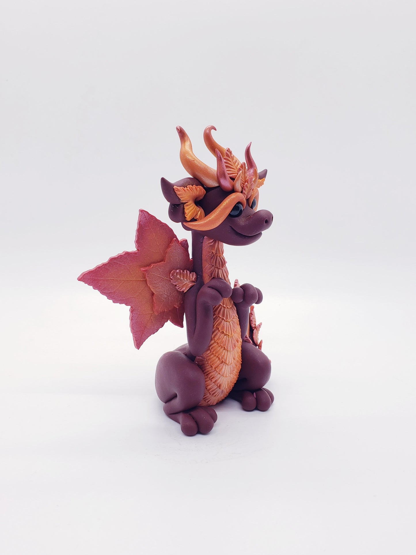 "Foglia" red autumn leaf dragon sculpture