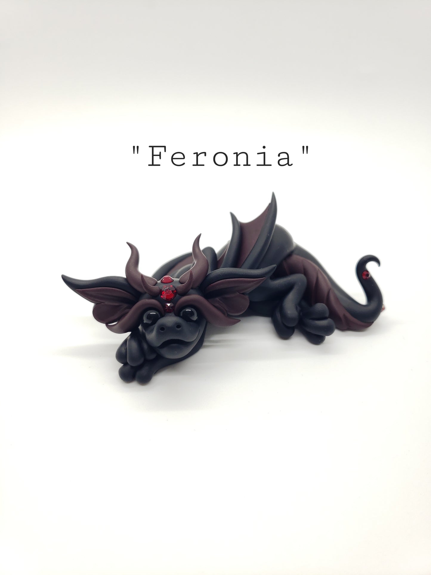 "Feronia" black and red dragon baby sculpture