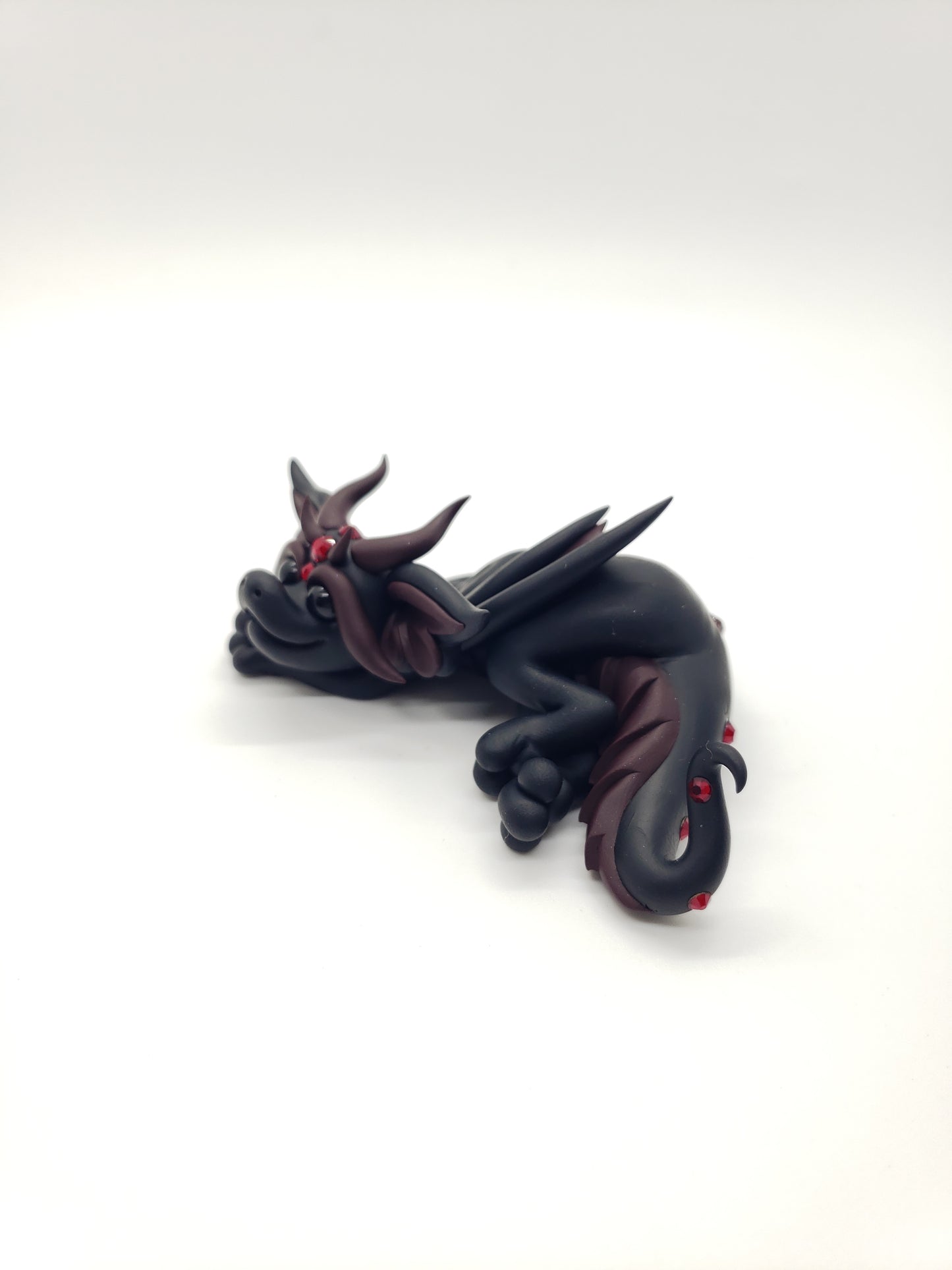 "Feronia" black and red dragon baby sculpture