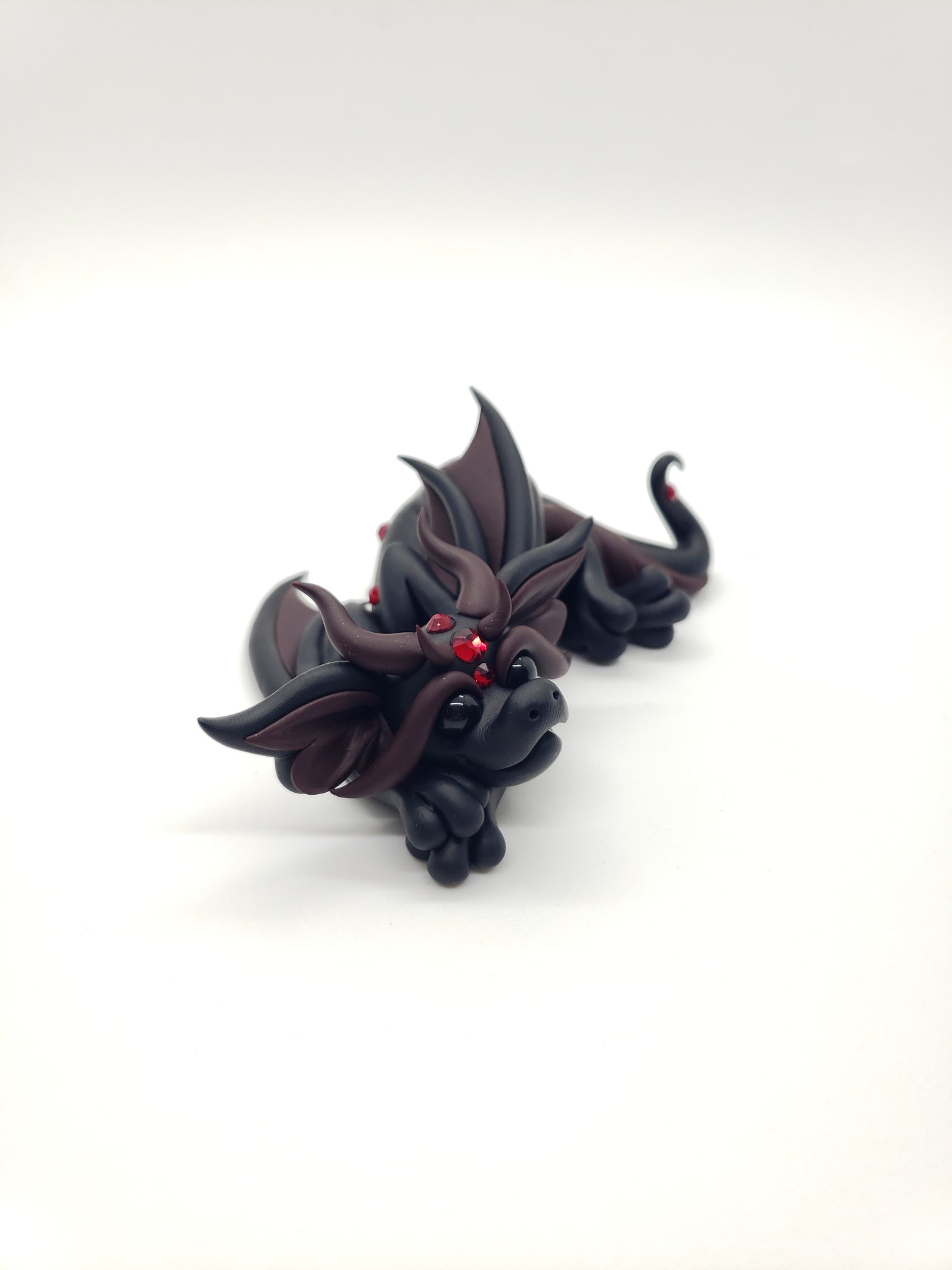 "Feronia" black and red dragon baby sculpture