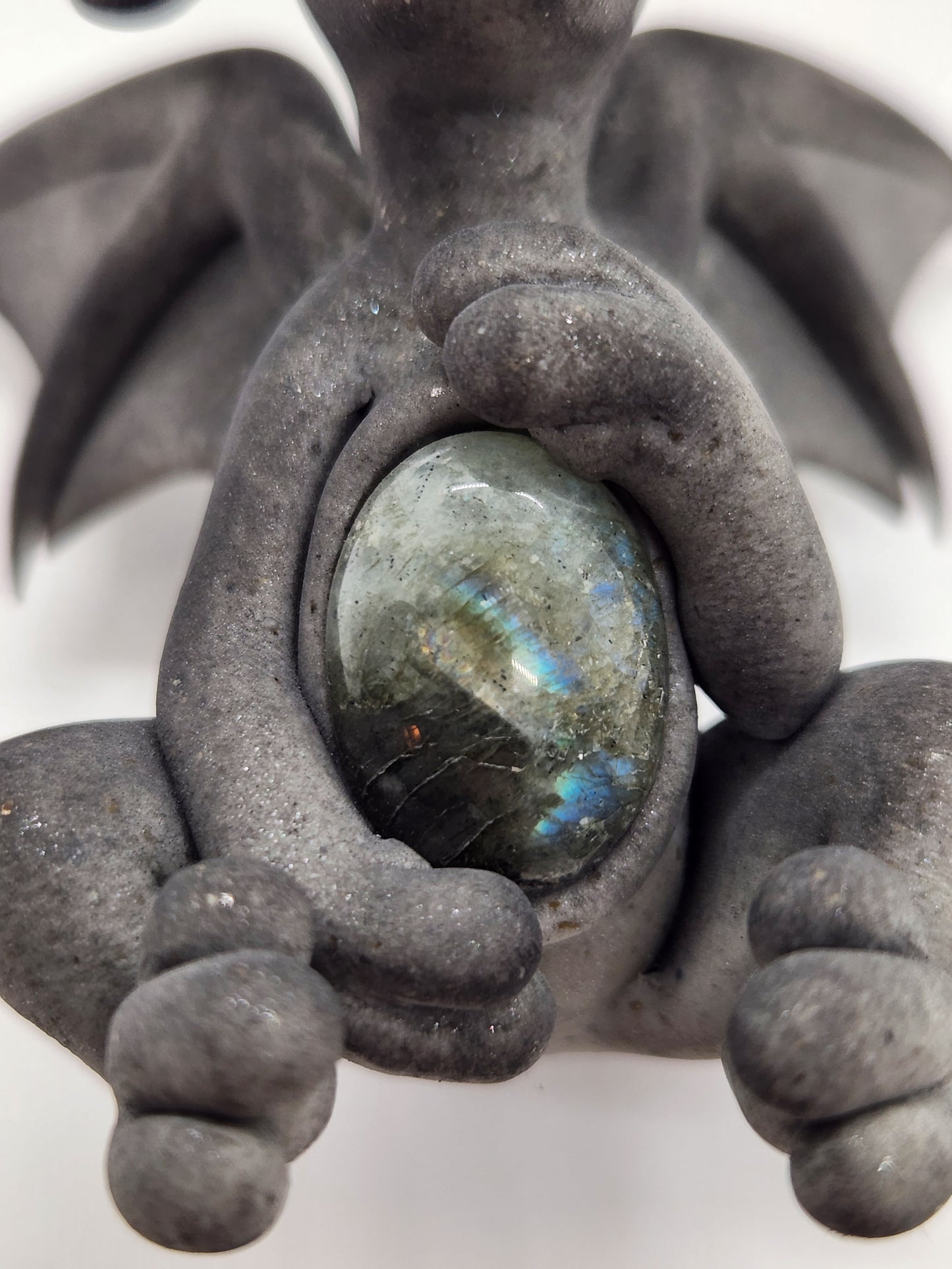 "Socha" gray dragon sculpture with labradorite belly