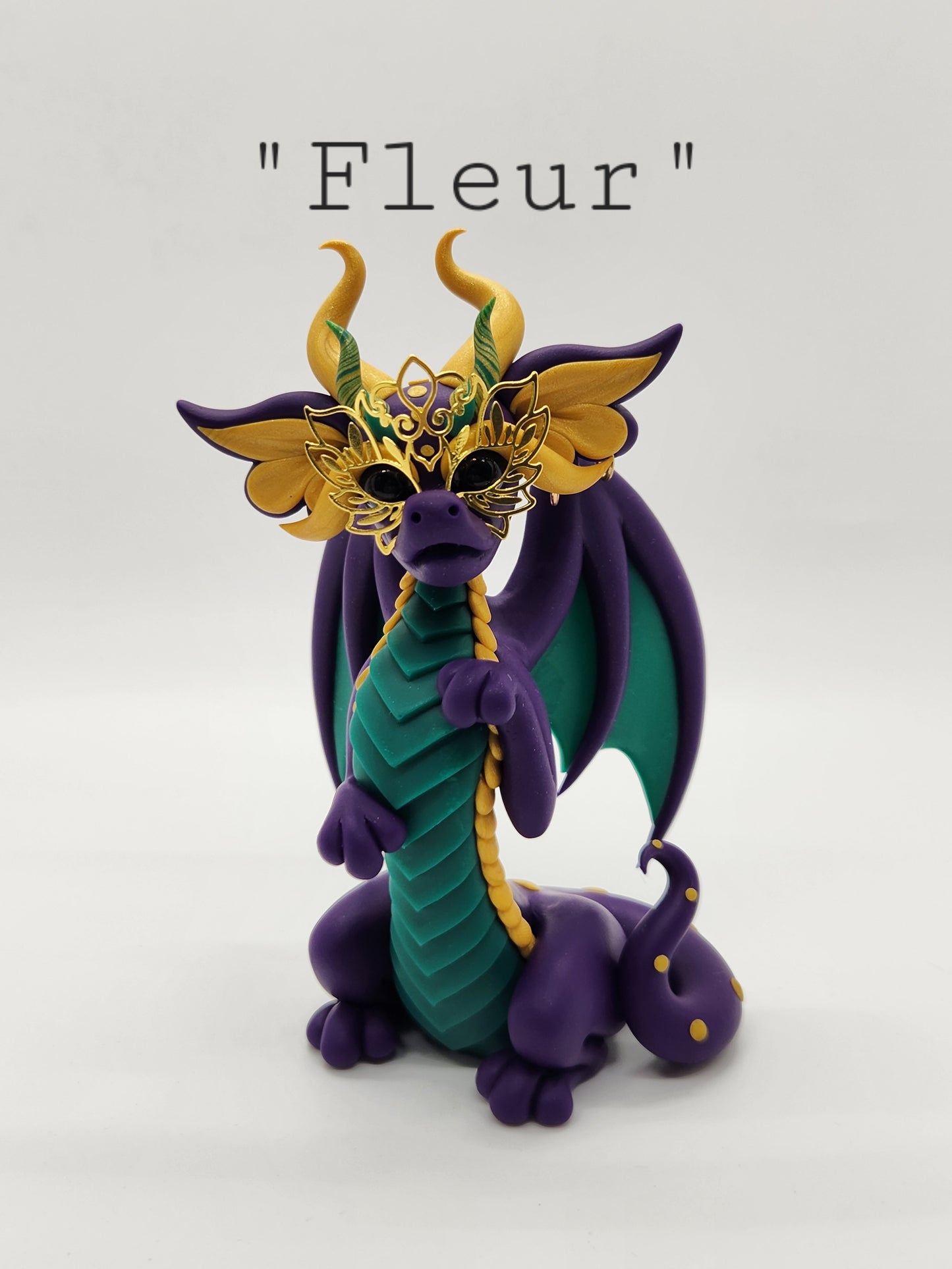 "Fleur" purple masked mardi gras dragon sculpture