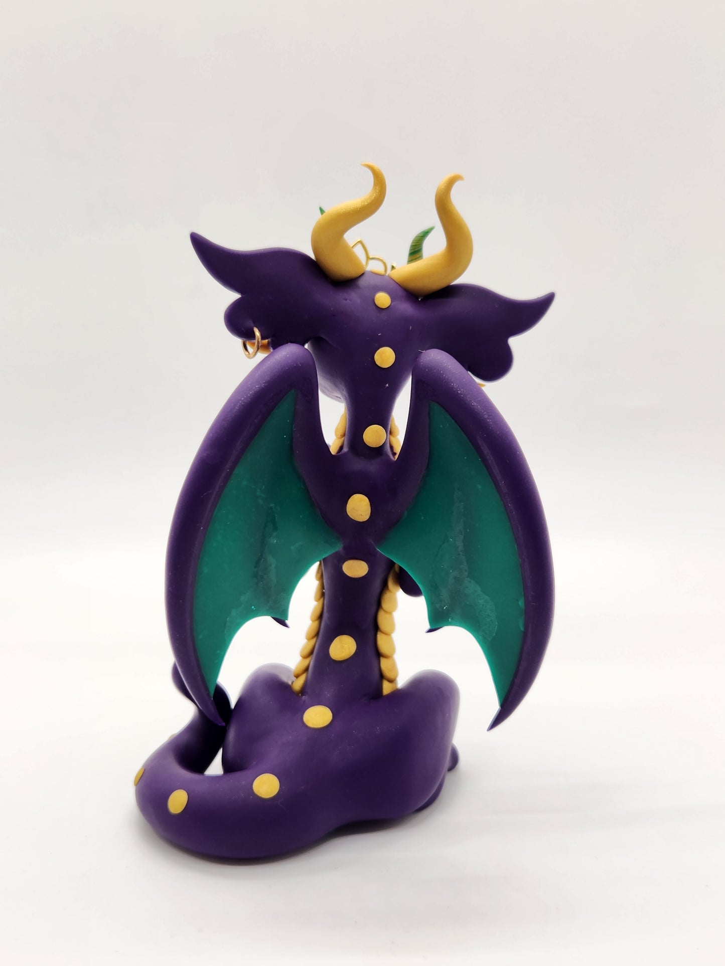 "Fleur" purple masked mardi gras dragon sculpture