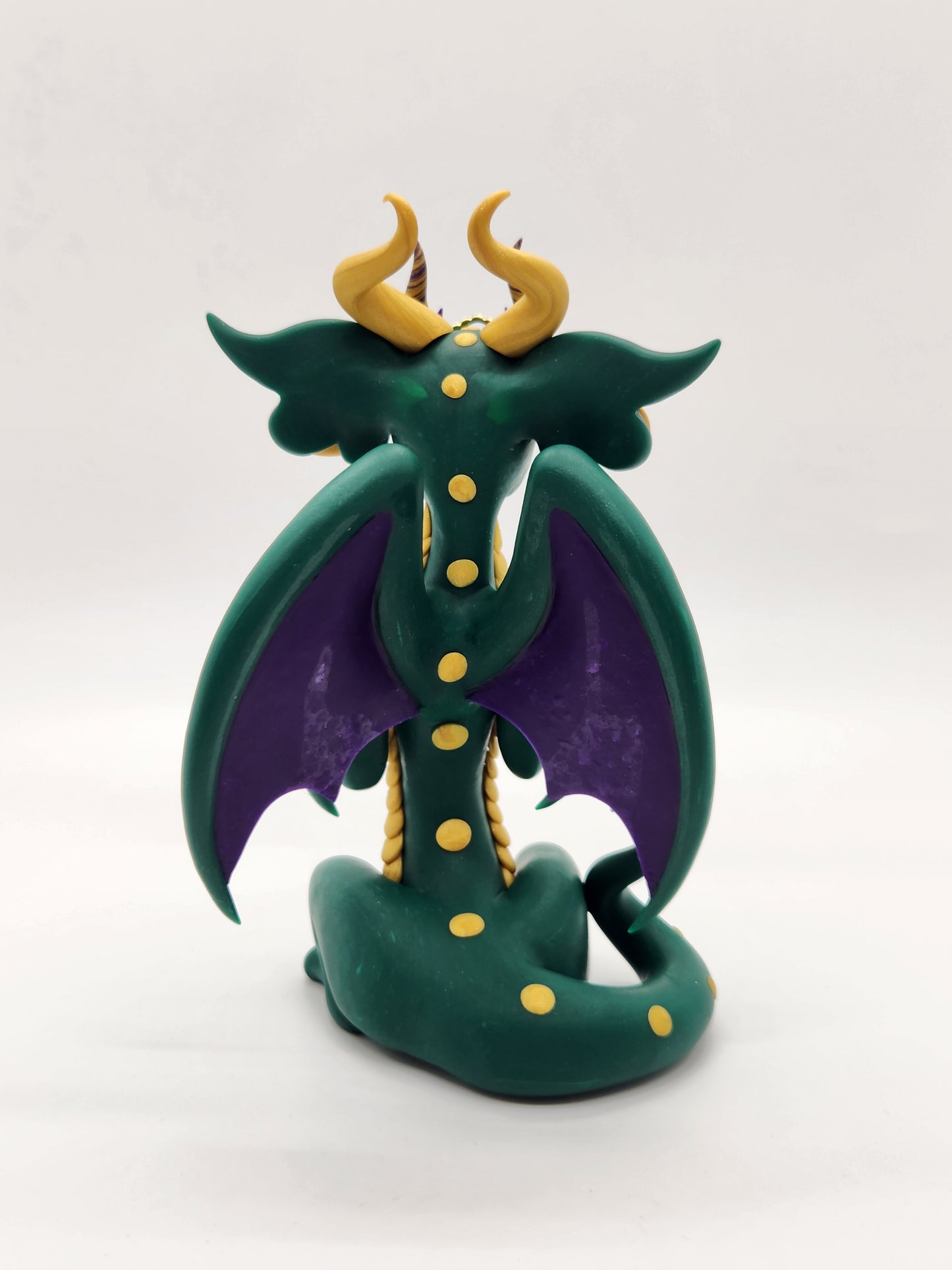 "DeLis" green masked mardi gras dragon sculpture