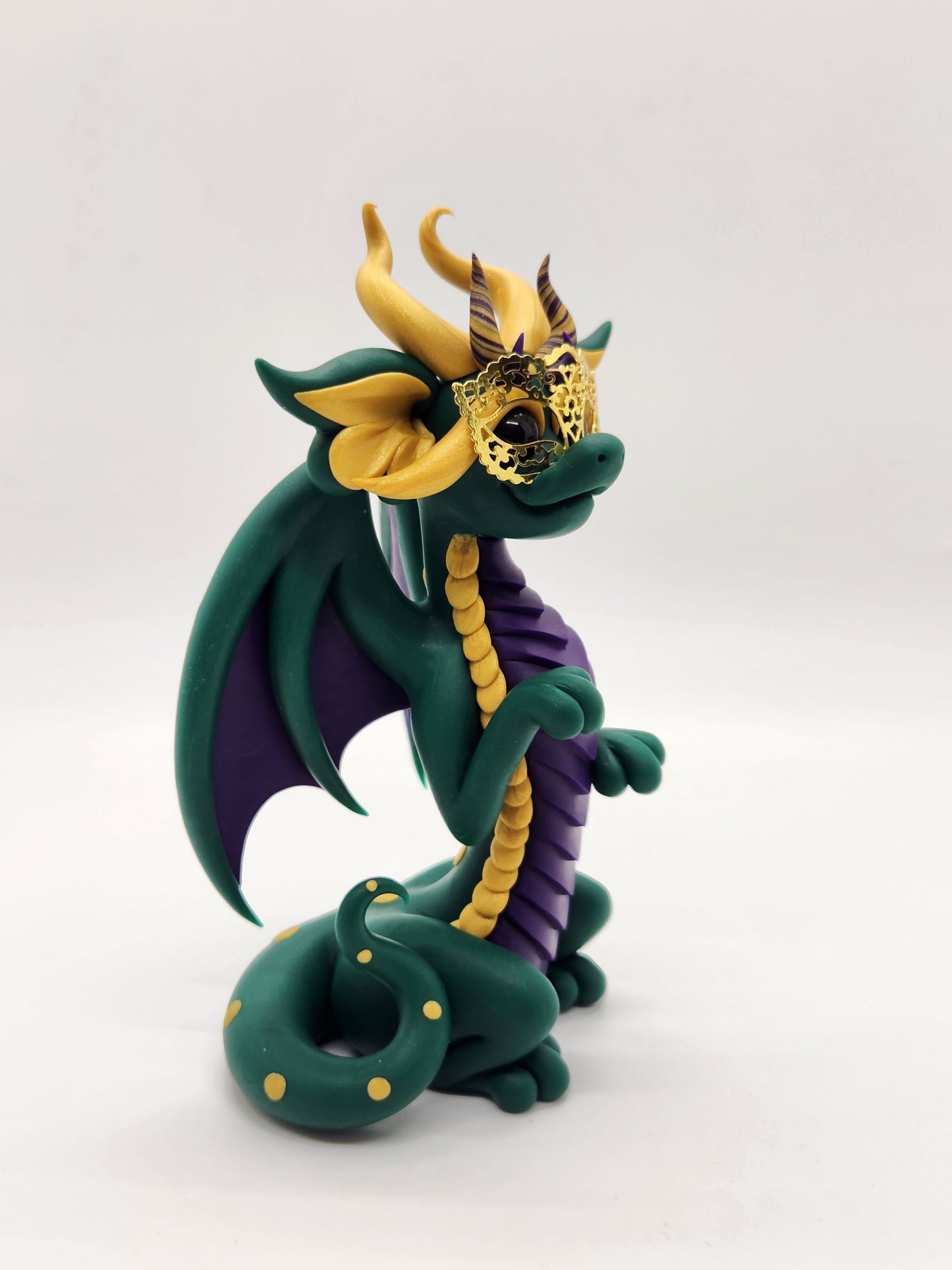 "DeLis" green masked mardi gras dragon sculpture