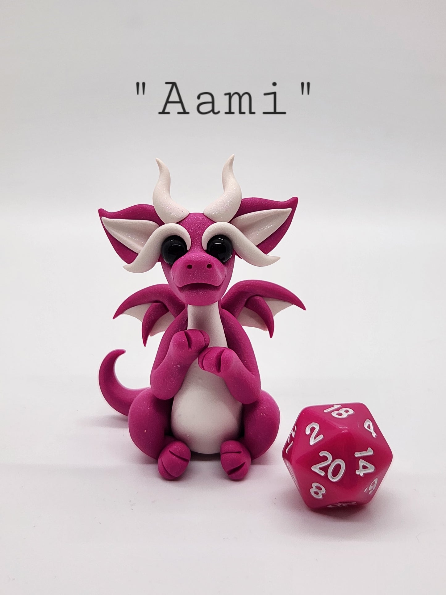 "Aami" pink squish baby dragon with d20