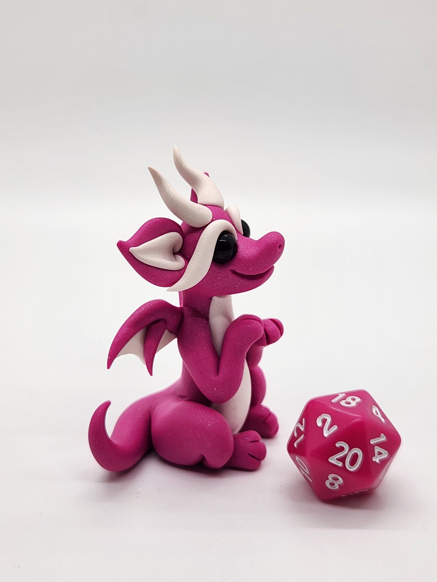 "Aami" pink squish baby dragon with d20