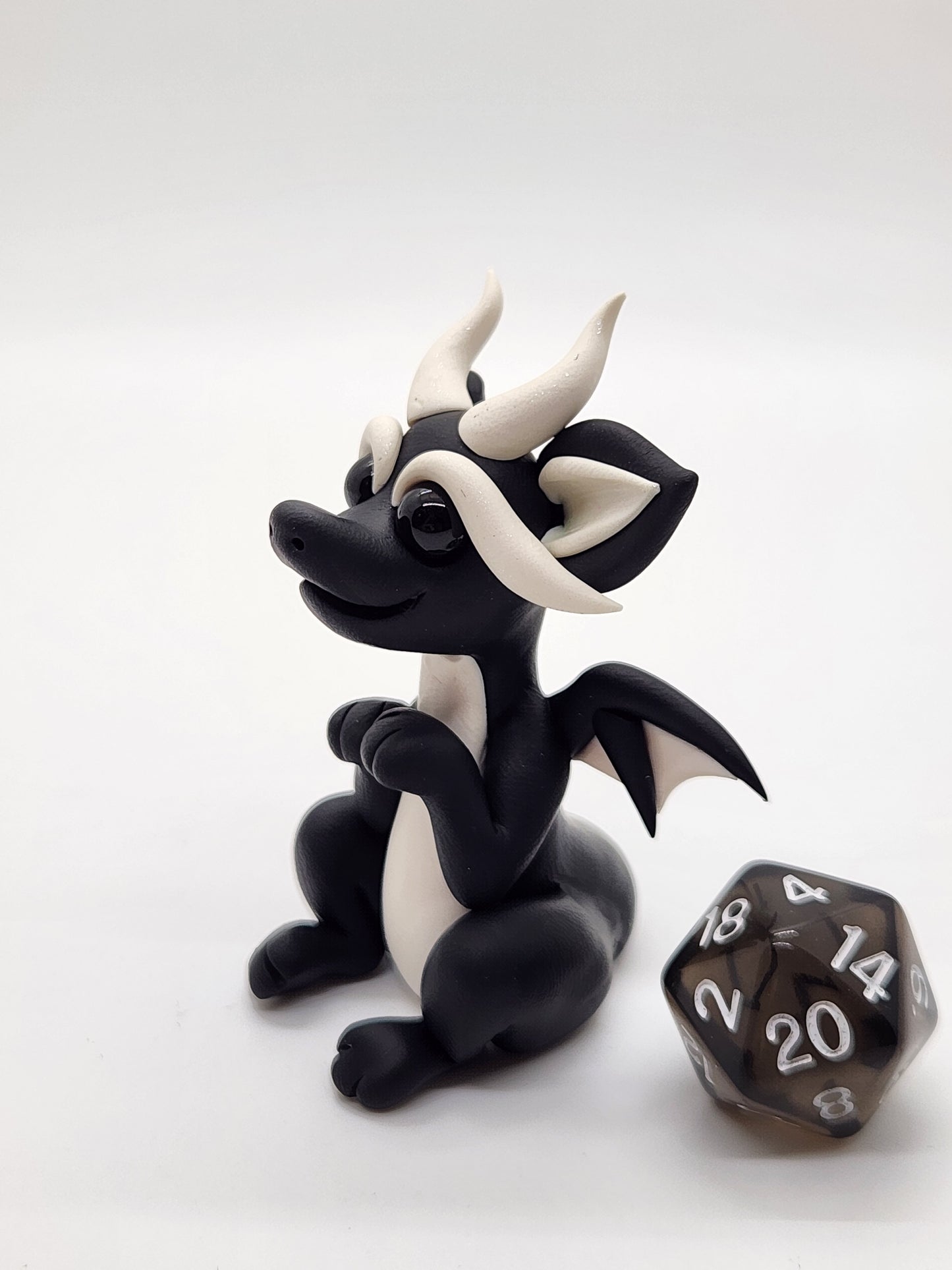 "Minik" black squish baby dragon with d20