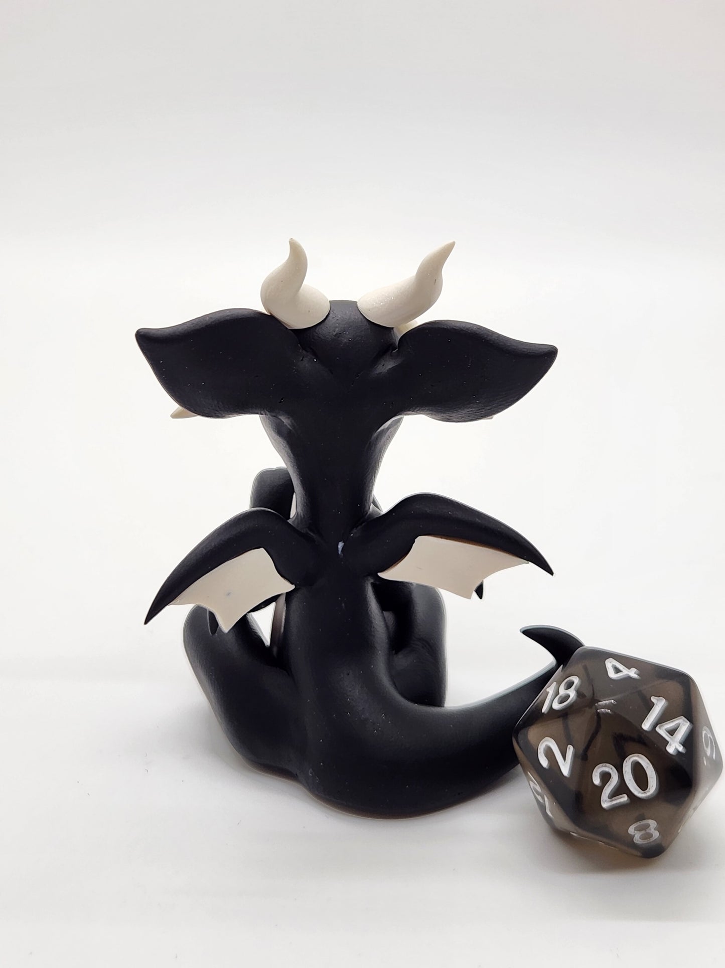 "Minik" black squish baby dragon with d20