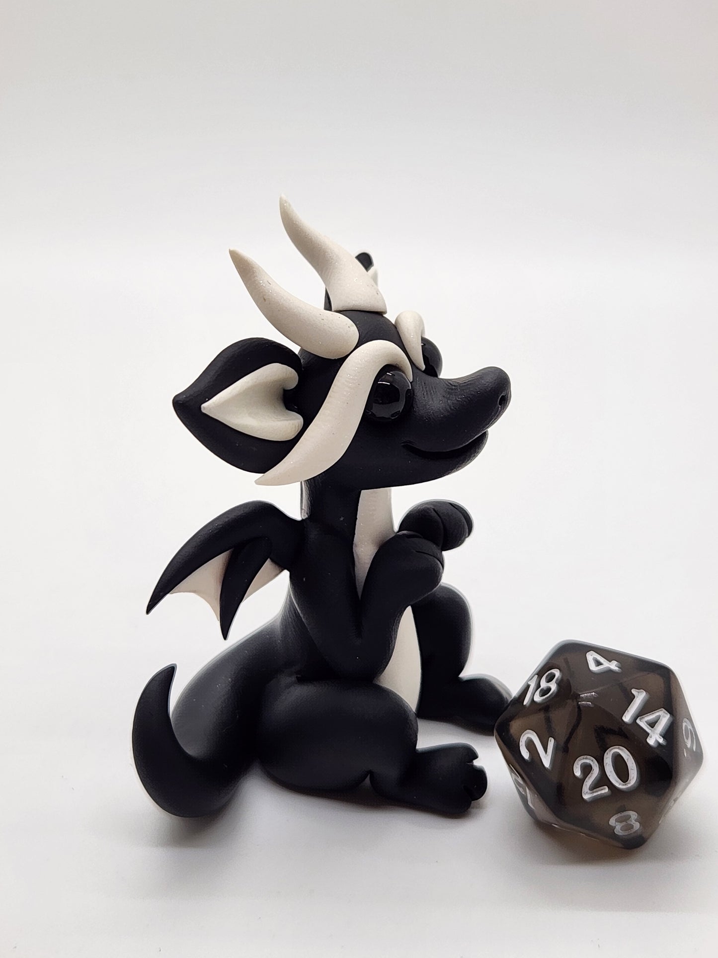 "Minik" black squish baby dragon with d20